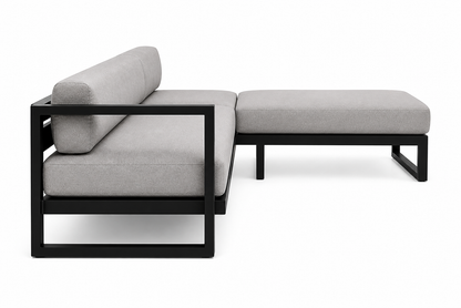 Artisanal outdoor sofa featuring clean architectural lines and plush seating