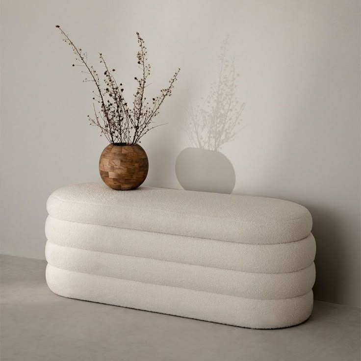 Handcrafted upholstered ottoman in a contemporary residential setting