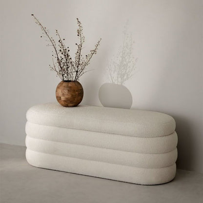 Handcrafted upholstered ottoman in a contemporary residential setting