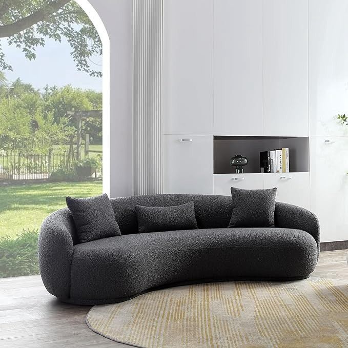 Modern Asante couch with a unique slanting curved silhouette