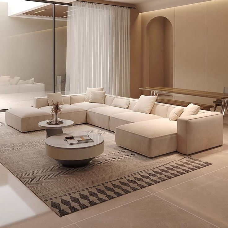 Modern artisanal U-shaped sofa in an open-plan living room