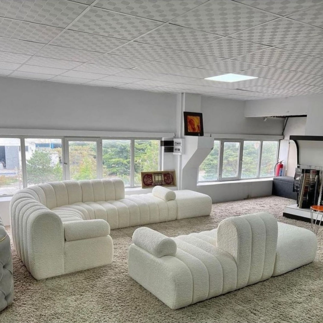 Luxury Austira set featuring a large curved sofa and straight couch